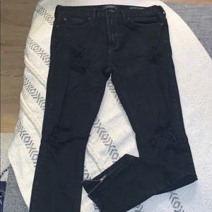 Black ripped stacked skinny jeans